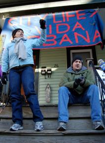 Neighbors and supporters of City Life/Vida Urbana protest the eviction of Melonie Griffiths-Evans from her home